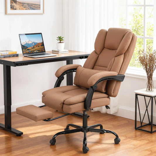 Tan leather executive office chair with footrest and black base in modern home office setting