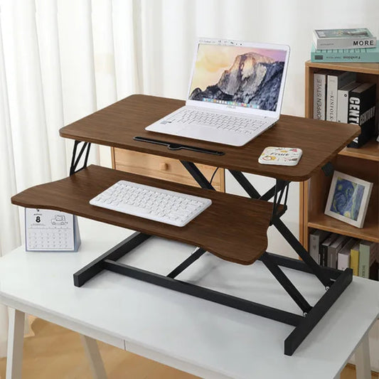 Brown wooden dual-tier standing desk converter with black metal frame, laptop and keyboard on separate levels.